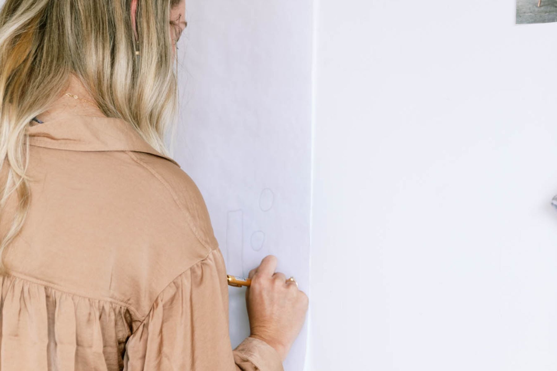 teacher writing on white board