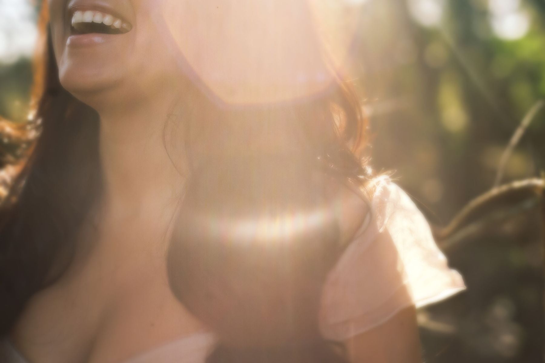 close up woman smiling in sunlight