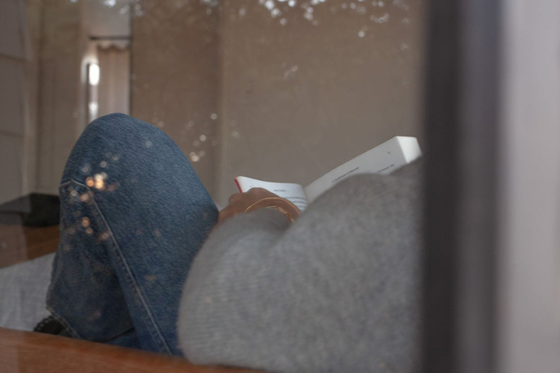 Woman reading on the sofa , a quiet moment for herself