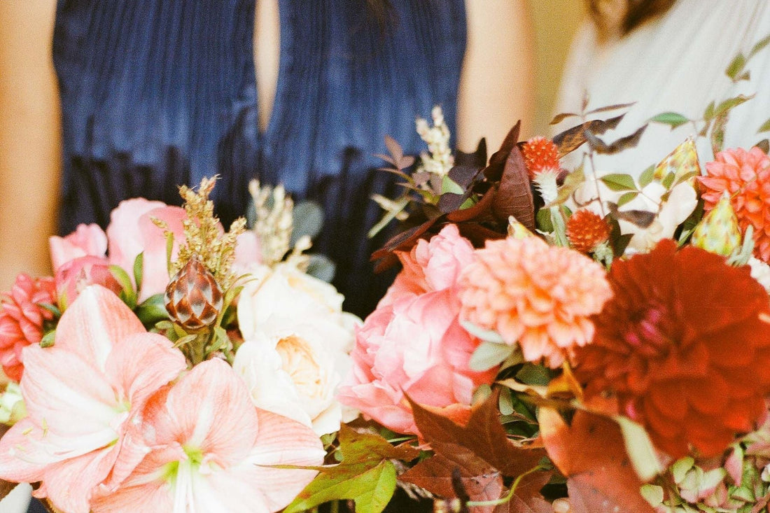 bride and bridesmaid holding flowers