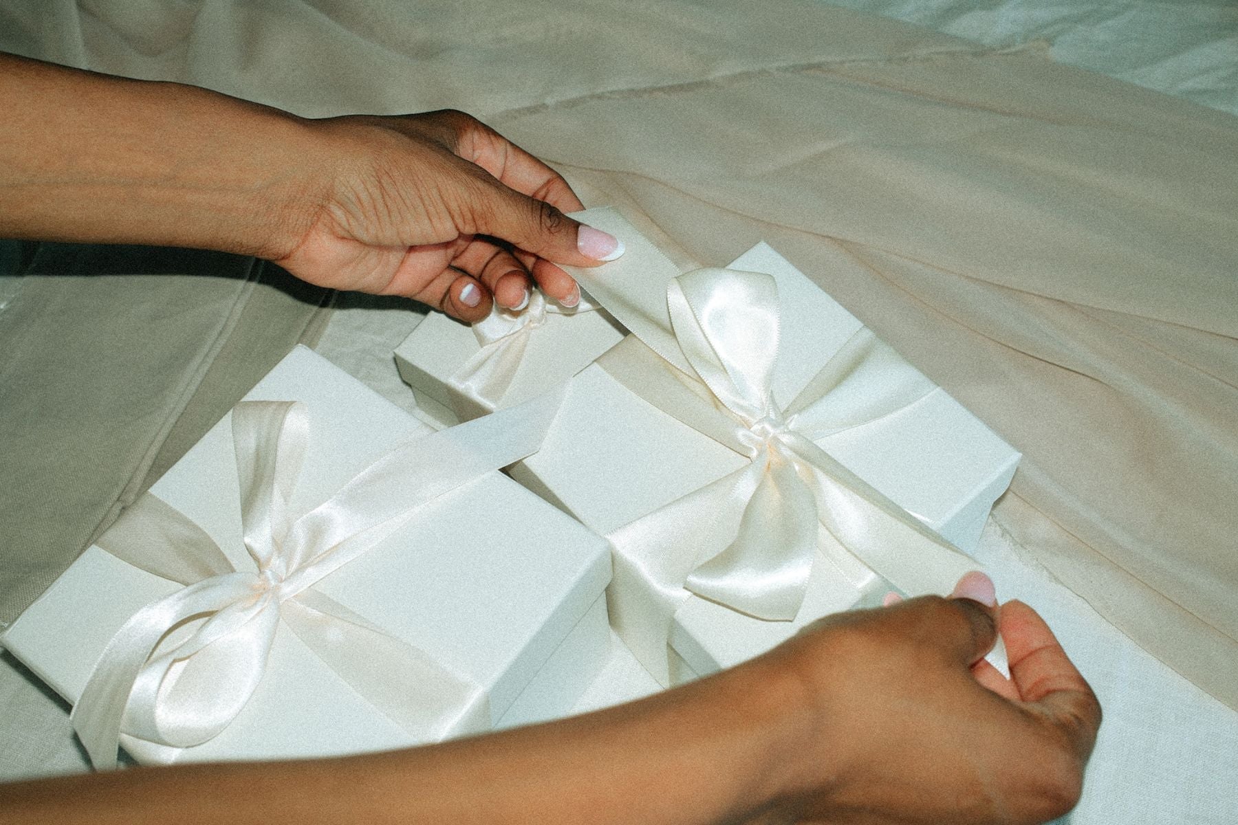 hands wrapping gifts