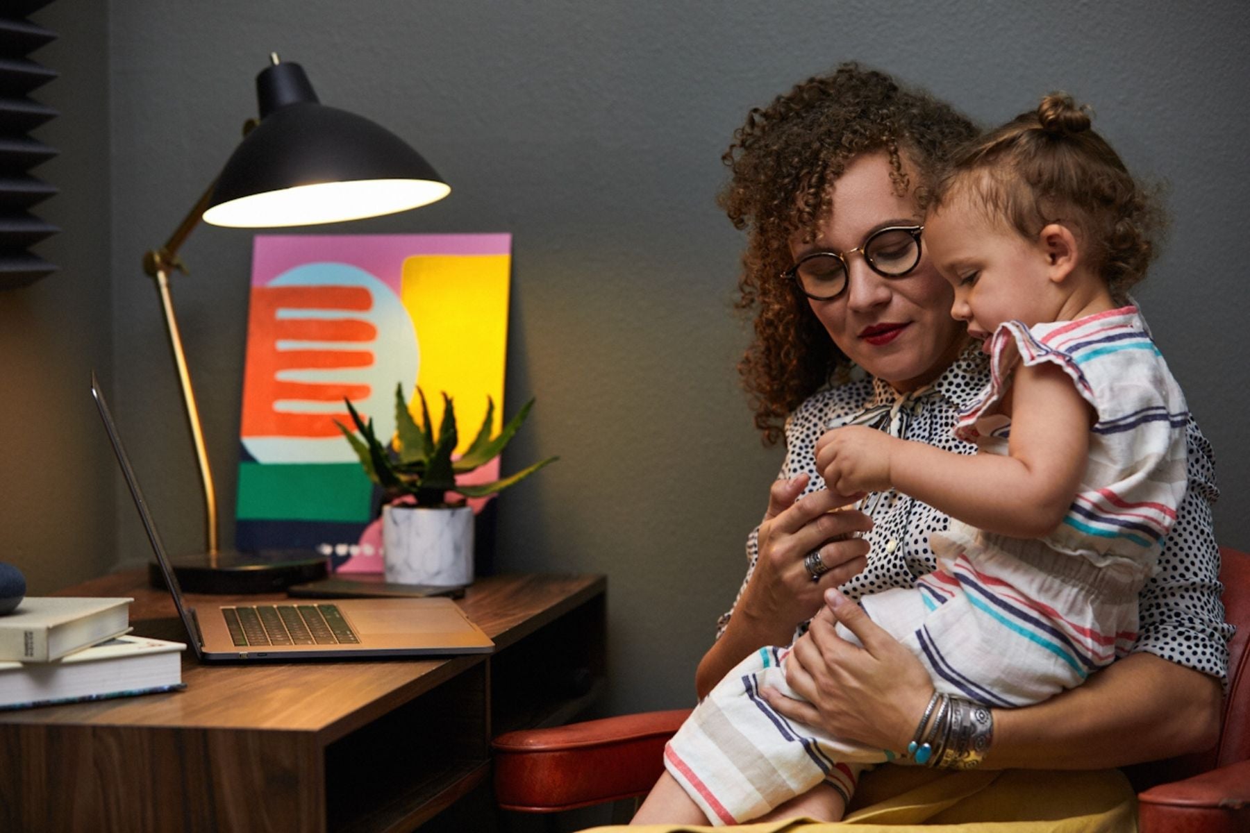 mum and toddler sitting at desk