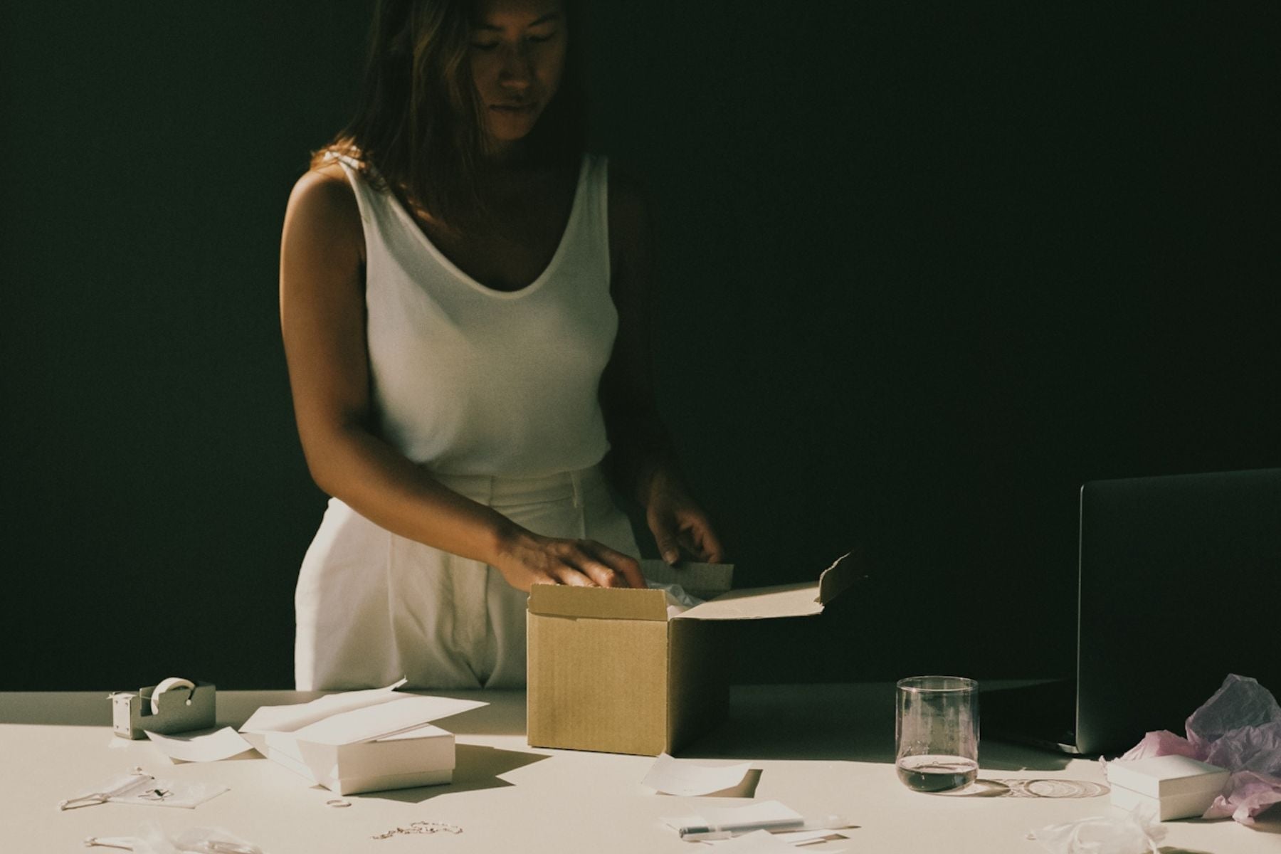 woman opening a gift box