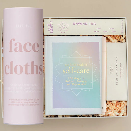 single use face cloths, unwind tea, little book of self care, tea lights, pen in a gift box